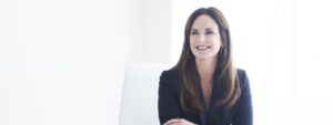 Mary Ann O'Brien sitting at desk