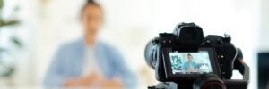 Man sitting in front of video camera